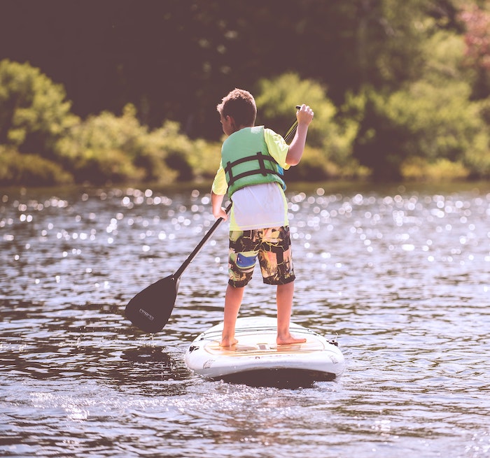 Child Paddle Boarding with Life Jacket